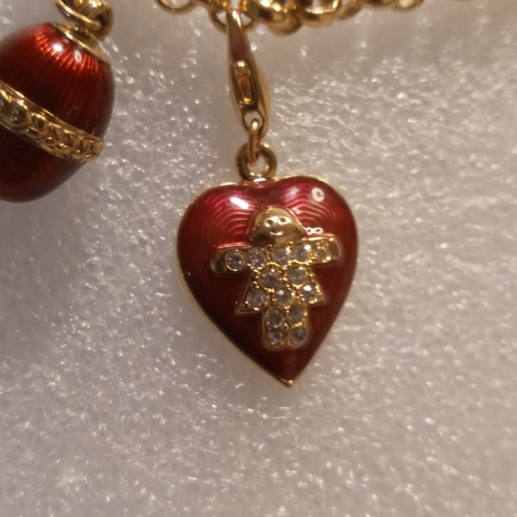 Faberge egg charm bracelet on a gold tone rolo chain. - Picture 8 of 16